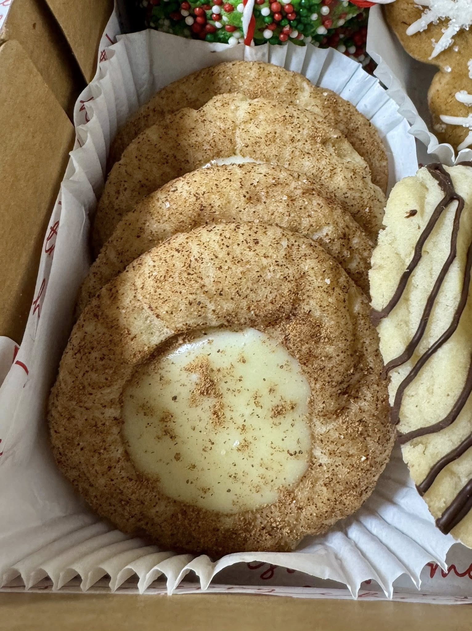 Snickerdoodle thumbprint cookies with eggnog ganache